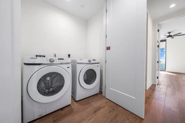 a utility room with sink dryer and washer