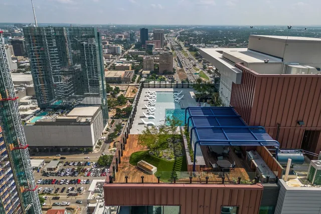 a view of a balcony with wooden floor and city view