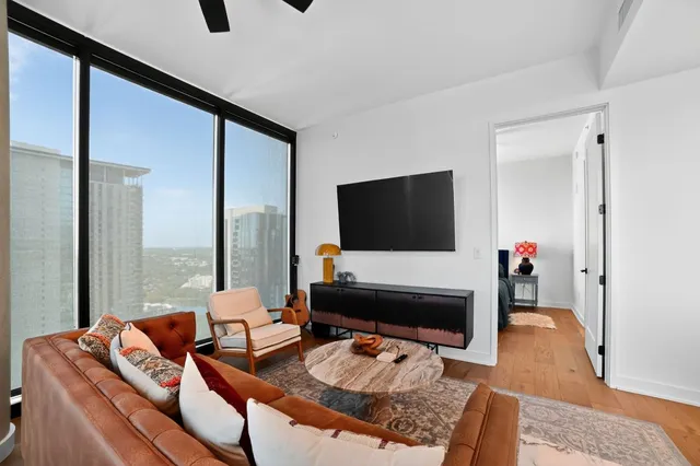 a living room with furniture and a flat screen tv