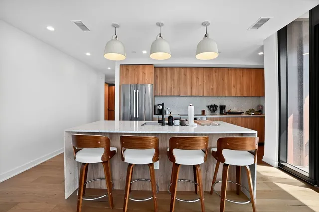 a kitchen with a table and chairs in it