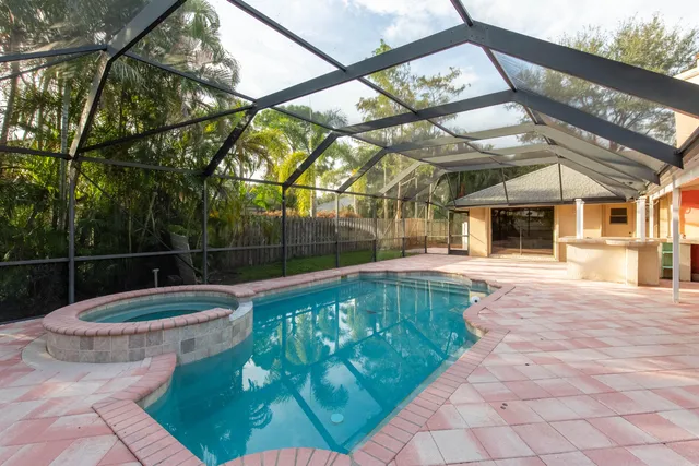 a view of a white building with a swimming pool