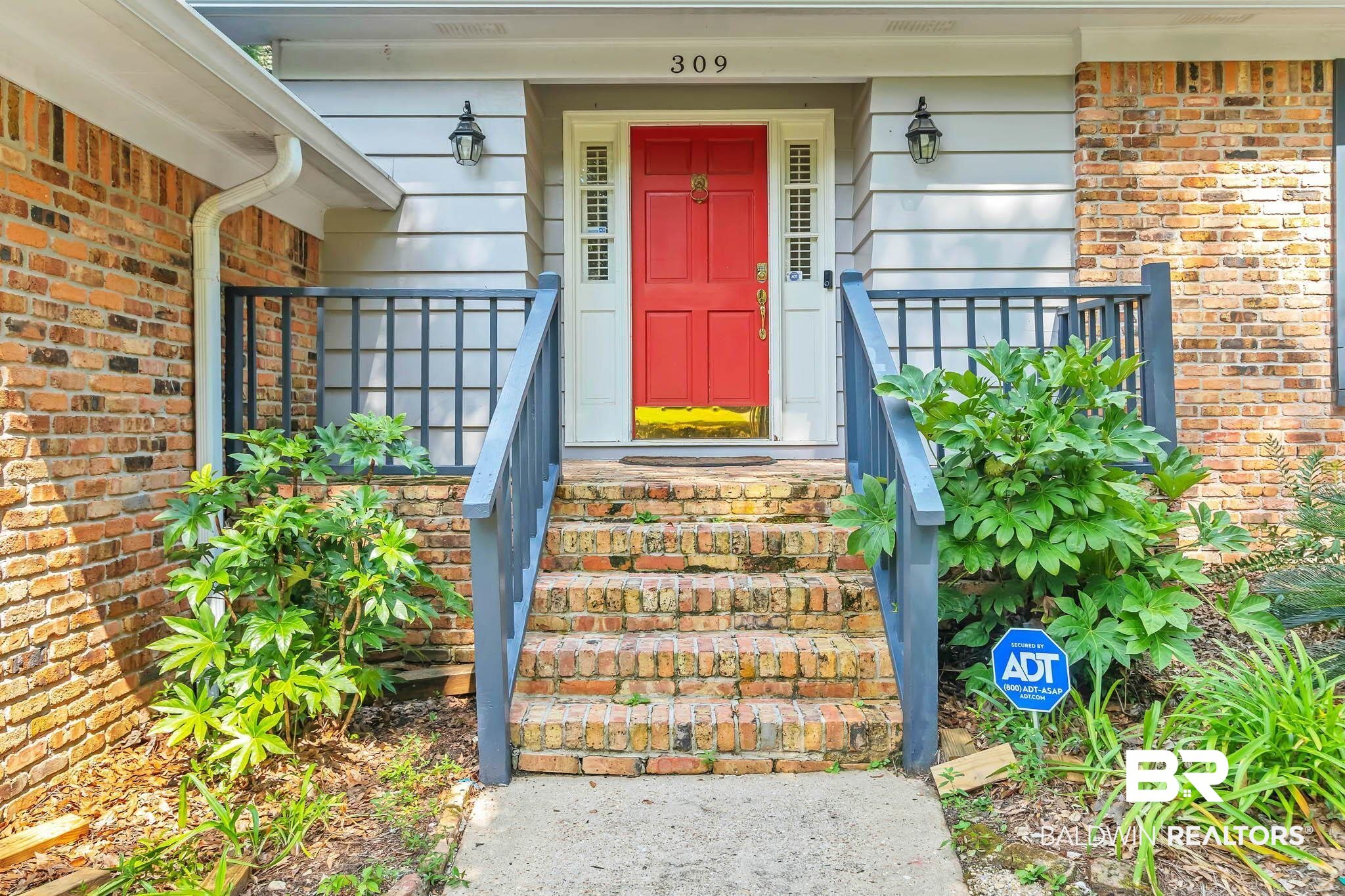 309 West Brandy Run Road Mobile, AL 36608 - Photo 9 of 100 Doorway to property with brick siding