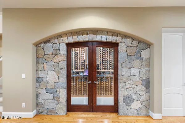 a lobby with furniture and a flat screen tv
