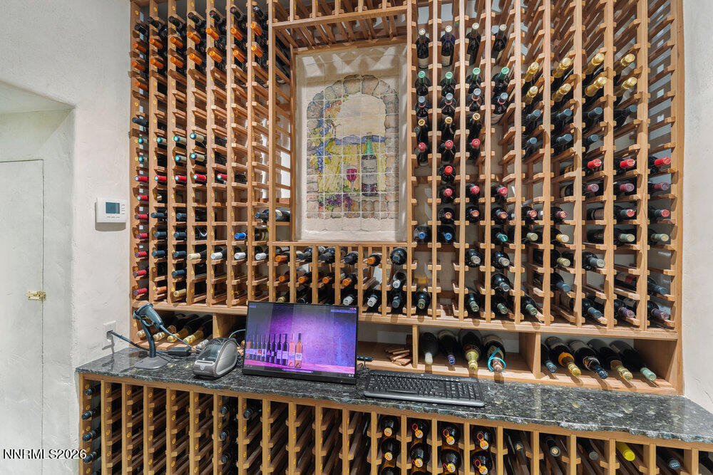 6065 Lake Geneva Drive Reno, NV 89511 - Photo 14 of 101 a bathroom with a granite countertop sink and a mirror