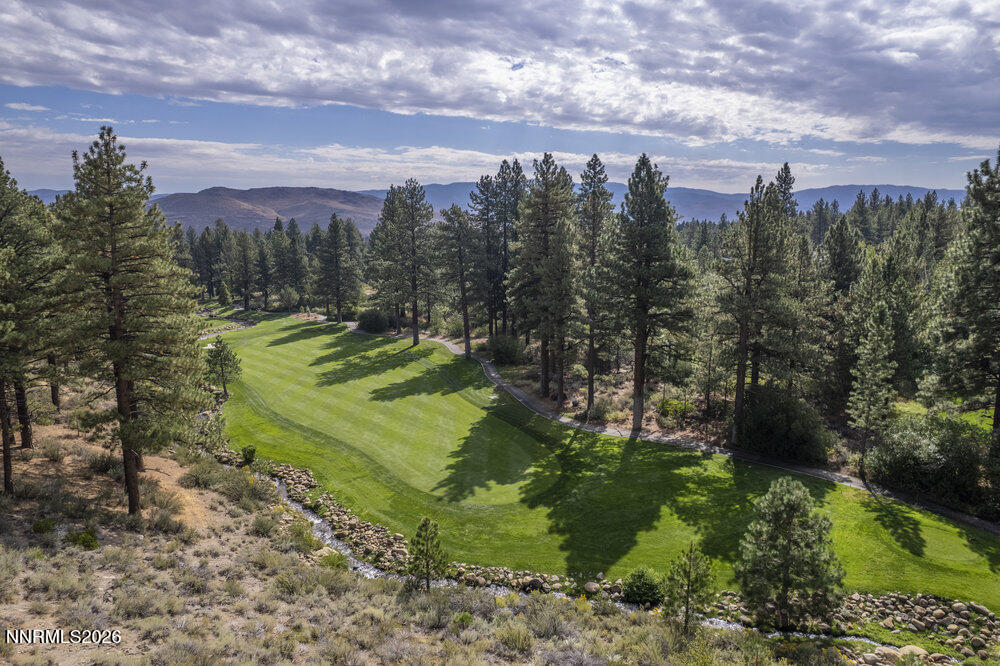 6065 Lake Geneva Drive Reno, NV 89511 - Photo 17 of 101 a view of a garden with a building in the background