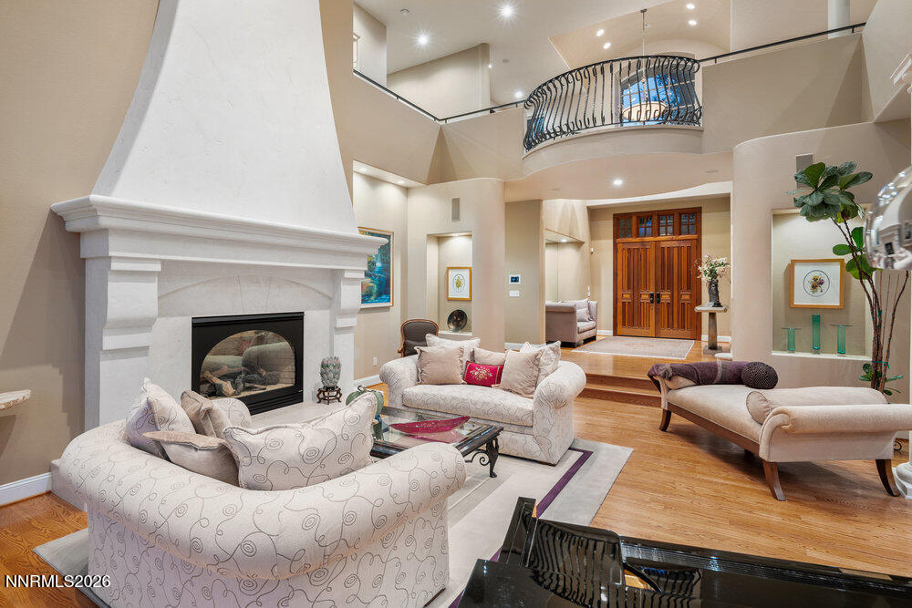 6065 Lake Geneva Drive Reno, NV 89511 - Photo 22 of 101 a living room with furniture and a fireplace