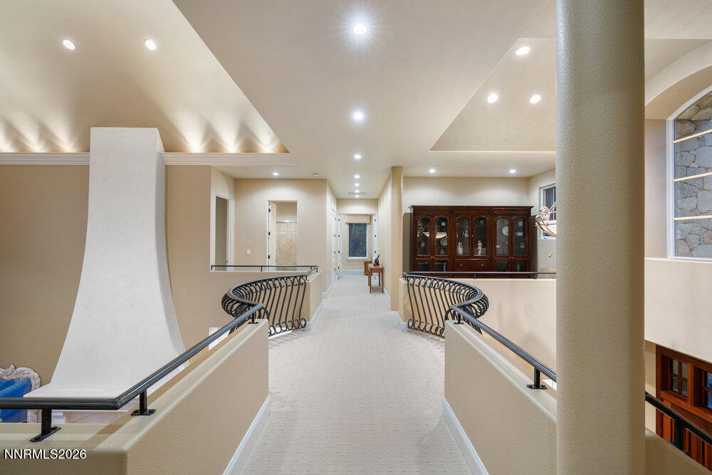 6065 Lake Geneva Drive Reno, NV 89511 - Photo 30 of 101 a lobby with furniture and a flat screen tv
