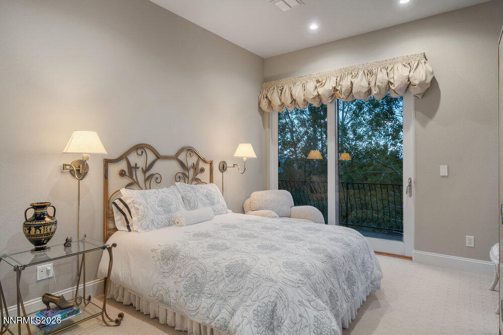 6065 Lake Geneva Drive Reno, NV 89511 - Photo 32 of 101 a bedroom with a bed and a window