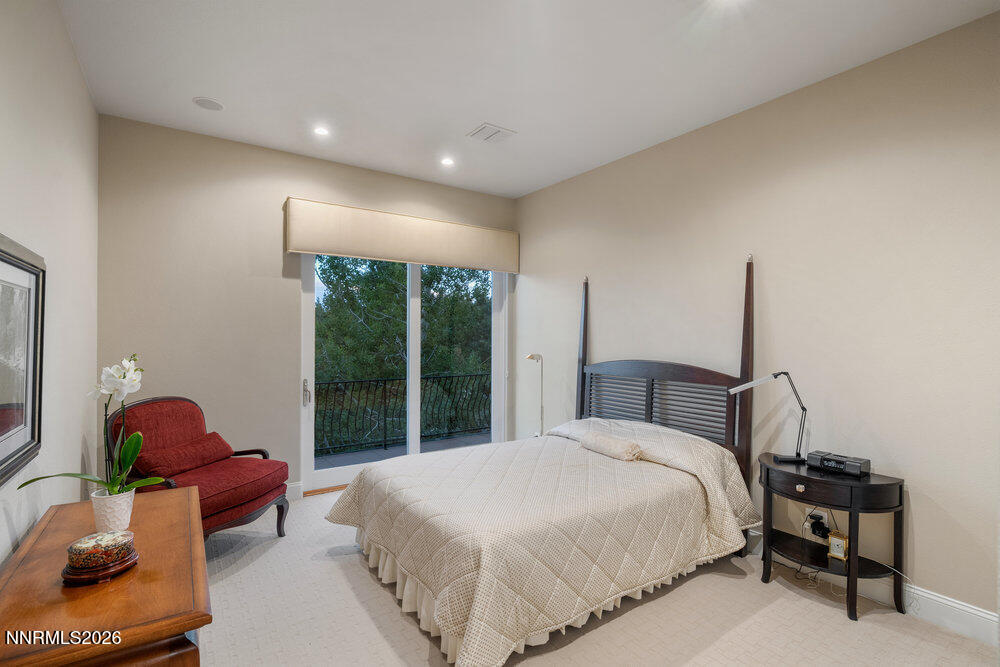 6065 Lake Geneva Drive Reno, NV 89511 - Photo 35 of 101 a bedroom with a bed and a window