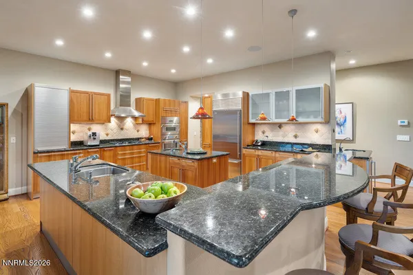 a living room with furniture and a glass door