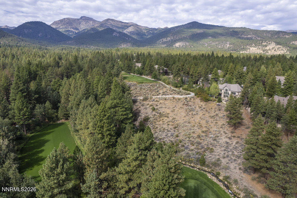 6065 Lake Geneva Drive Reno, NV 89511 - Photo 45 of 101 a view of a town with mountains in the background