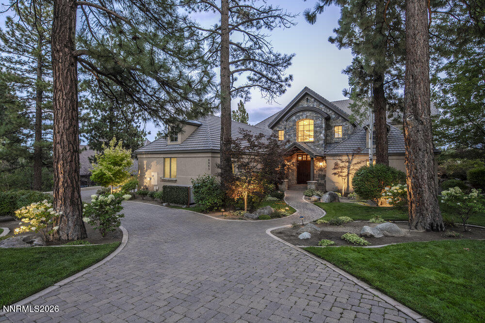 6065 Lake Geneva Drive Reno, NV 89511 - Photo 46 of 101 a front view of a house with a yard and outdoor seating