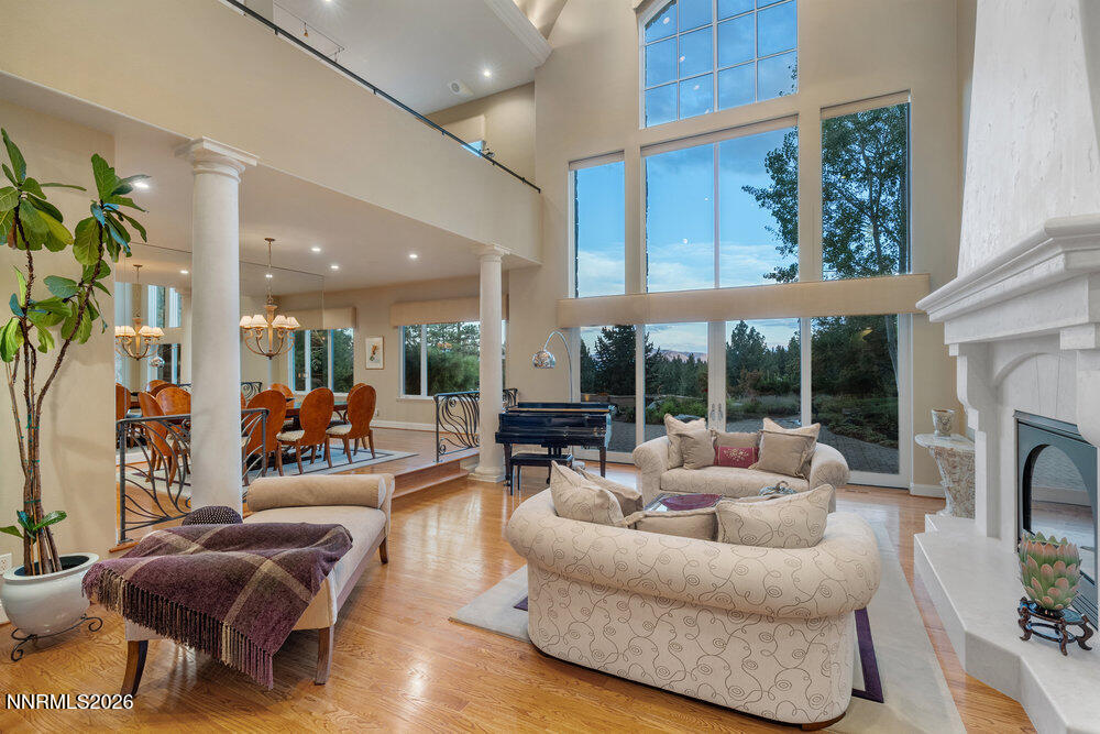6065 Lake Geneva Drive Reno, NV 89511 - Photo 48 of 101 a living room with furniture fireplace and a large window