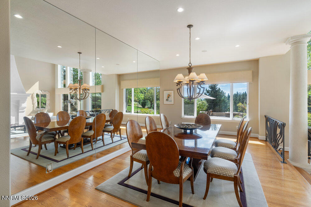 6065 Lake Geneva Drive Reno, NV 89511 - Photo 50 of 101 a dining room with furniture a chandelier and wooden floor