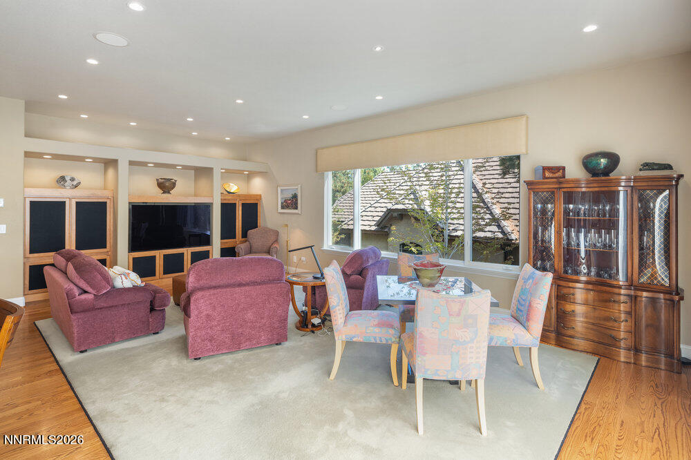 6065 Lake Geneva Drive Reno, NV 89511 - Photo 54 of 101 a living room with furniture a flat screen tv and a large window