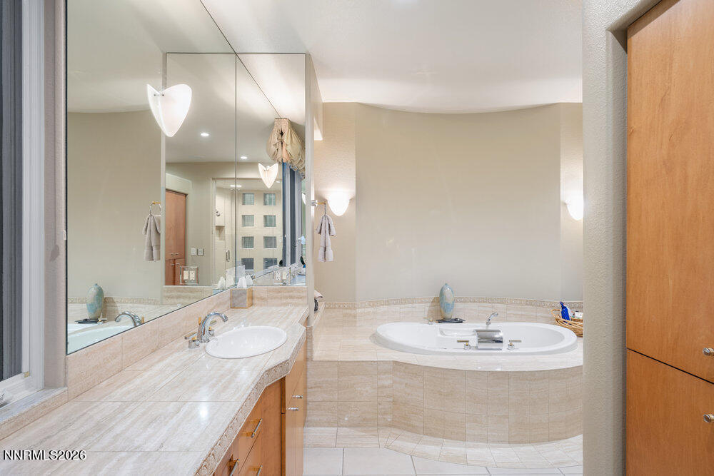 6065 Lake Geneva Drive Reno, NV 89511 - Photo 58 of 101 a bathroom with a sink double vanity and a mirror