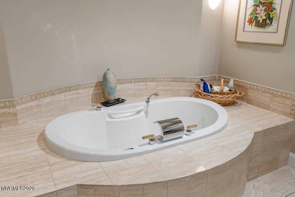 6065 Lake Geneva Drive Reno, NV 89511 - Photo 59 of 101 a bathroom with a sink and a mirror