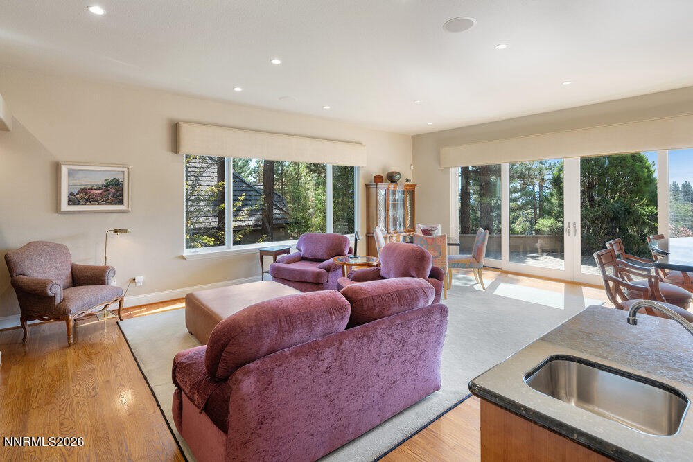 6065 Lake Geneva Drive Reno, NV 89511 - Photo 6 of 101 a living room with furniture and large windows