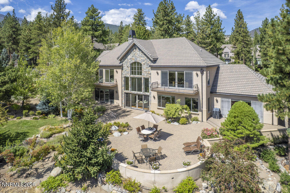 6065 Lake Geneva Drive Reno, NV 89511 - Photo 92 of 101 a aerial view of a house with table and chairs potted plants