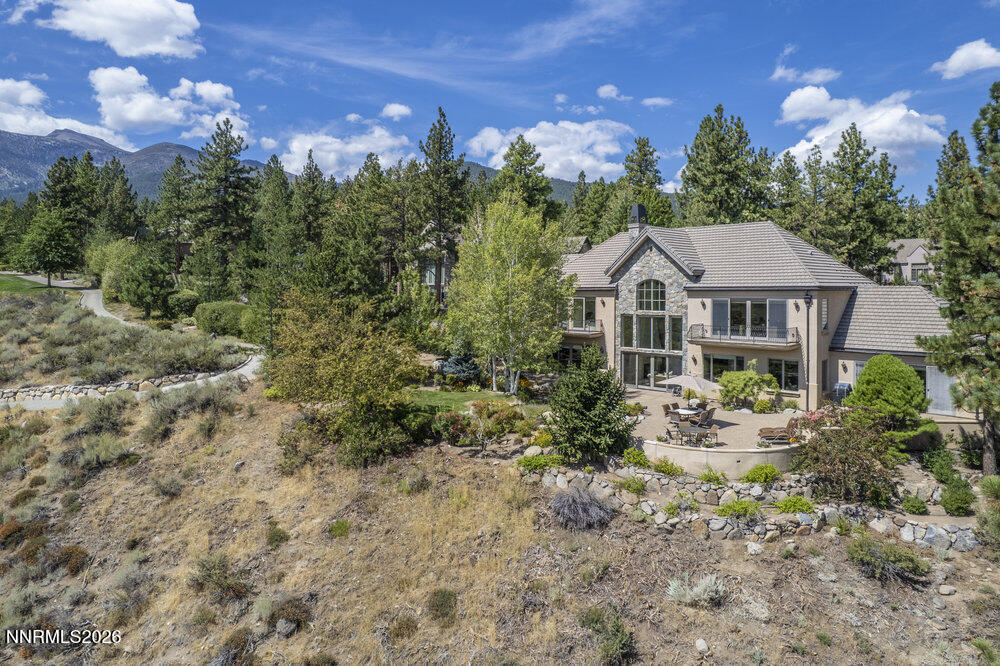 6065 Lake Geneva Drive Reno, NV 89511 - Photo 93 of 101 a front view of a house with a yard and green space
