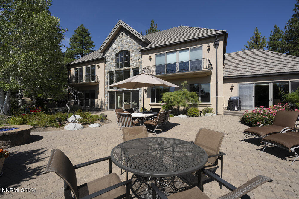 6065 Lake Geneva Drive Reno, NV 89511 - Photo 95 of 101 a view of a house with swimming pool and sitting area