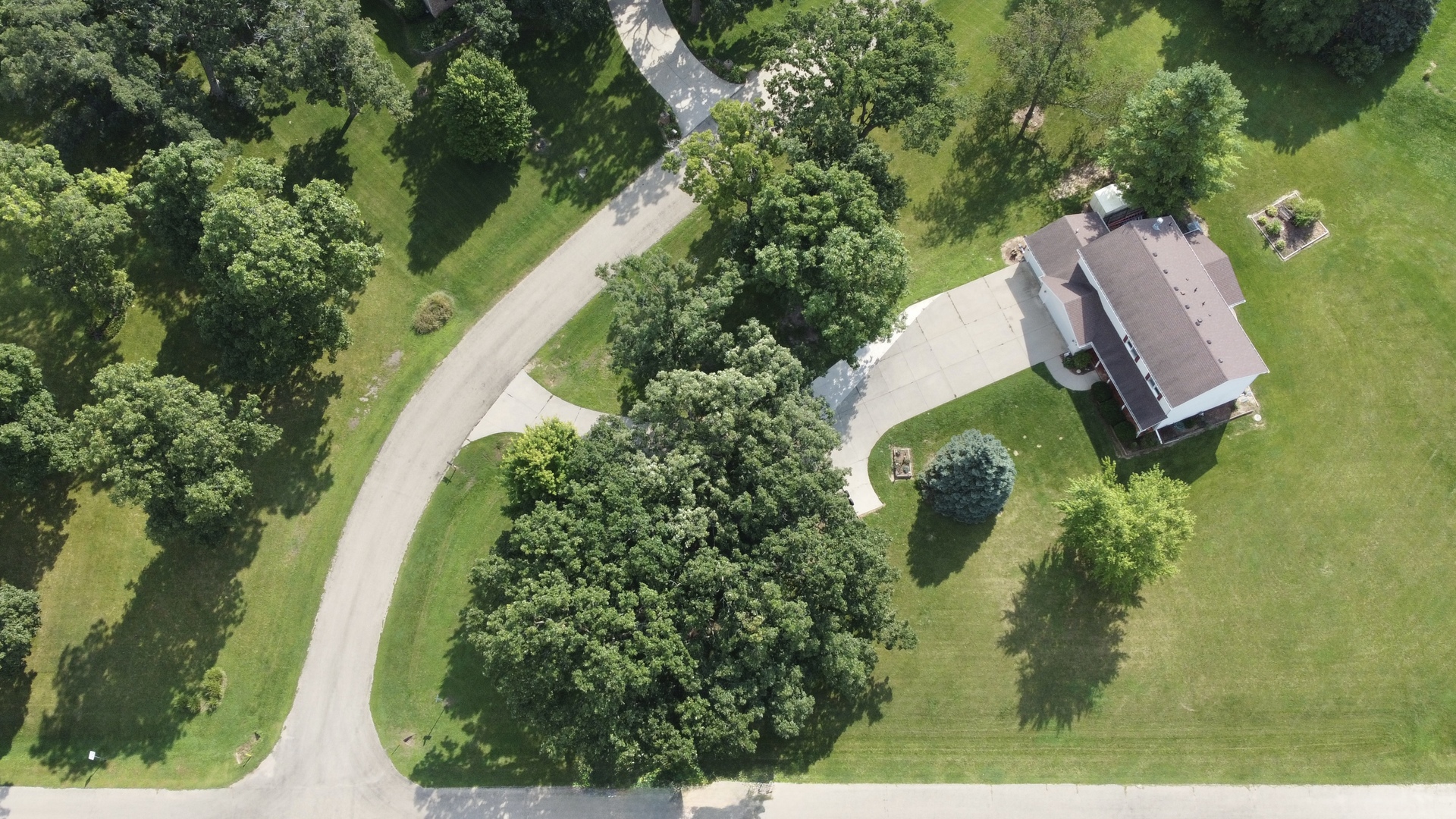 an aerial view of a house with outdoor space sitting space