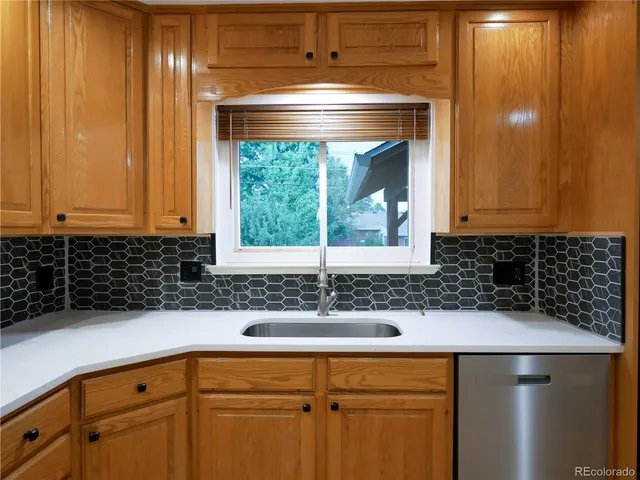 a kitchen with a sink and cabinets