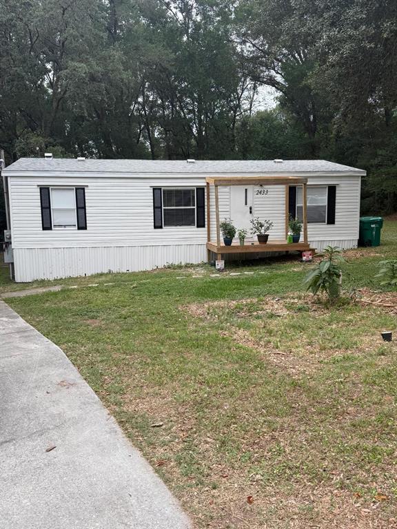 2433 East North Street Inverness, FL 34453 - Photo 2 of 11 a view of a house with backyard