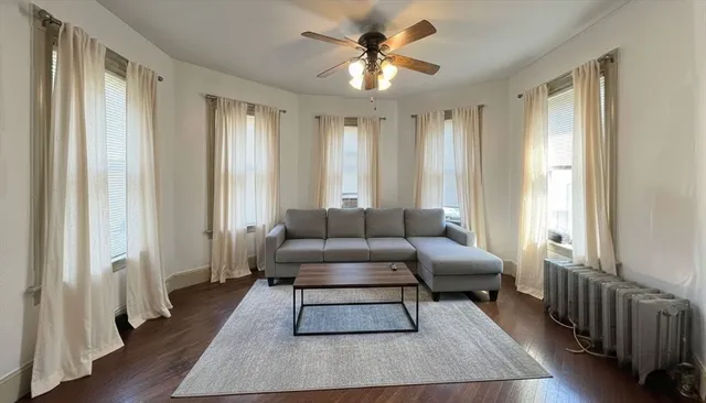 a living room with furniture and a rug