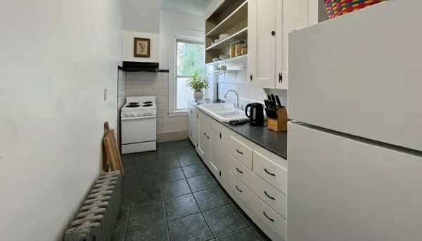 a kitchen with stainless steel appliances a sink and a stove top oven