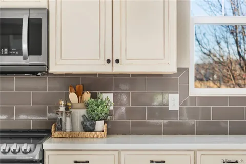 a bathroom with a potted plant and a window