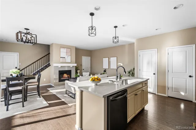 a view of living room with granite countertop furniture and fireplace