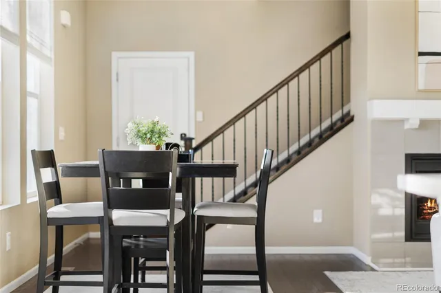 a view of entryway dining room and hall with wooden floor