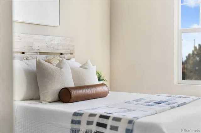 a bedroom with a bed and a couch