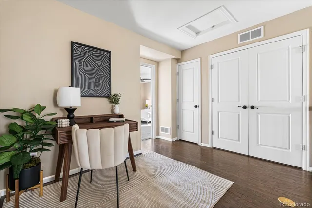 a workspace with furniture and wooden floor