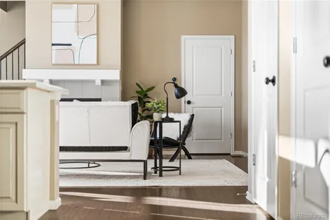 a view of a hallway with chair and table