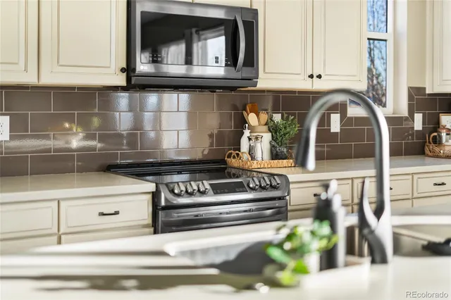 a kitchen with a stove and a microwave