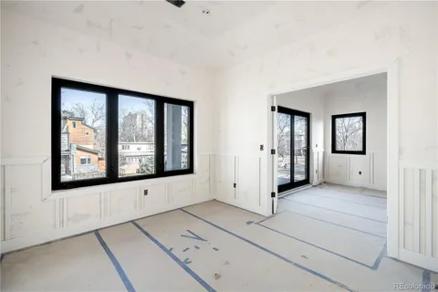a view of an entryway with wooden floor