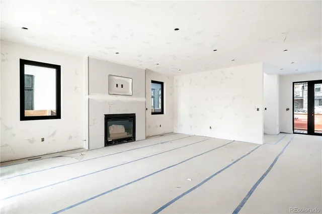 a view of livingroom with fireplace and window