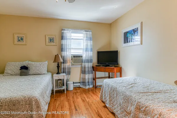 a bedroom with a bed and a fireplace