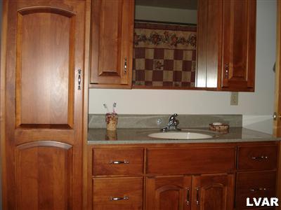 500 Point Phillips Road Bath, PA 18014 - Photo 24 of 31 a bathroom with a sink and a mirror