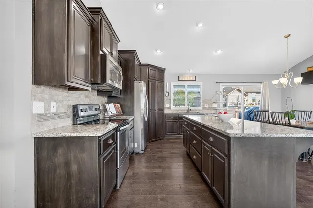 $390,000 | 117 South Westglen Drive, Raymore, MO 64083