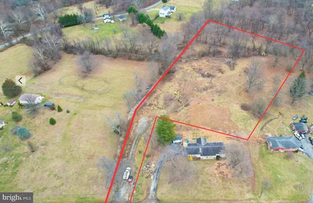 a kitchen that has a lot of windows on it