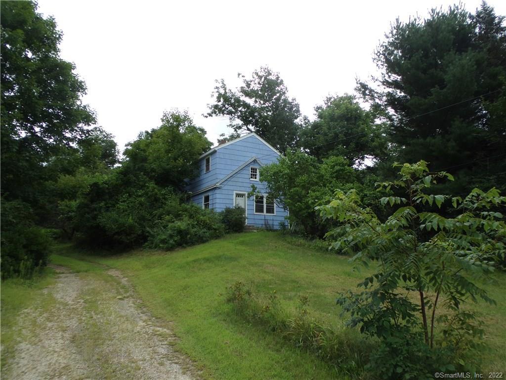 FRONT OF HOME, SET ON ELEVATED LOT BACK FROM STREET