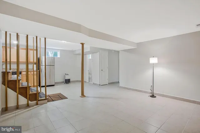 a view of a big room with windows and pillars in it