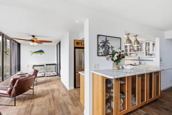 a living room with furniture and wooden floor
