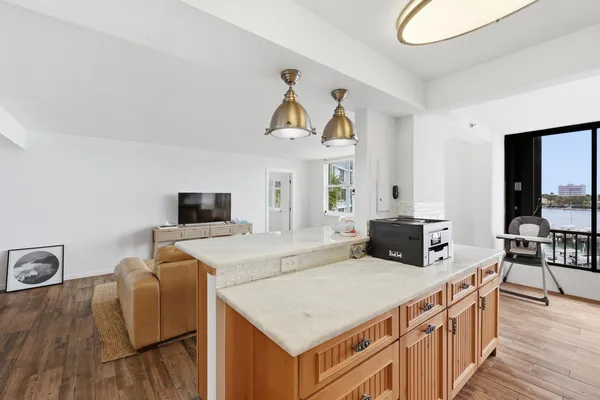 a kitchen with stainless steel appliances a stove a sink dishwasher and a refrigerator