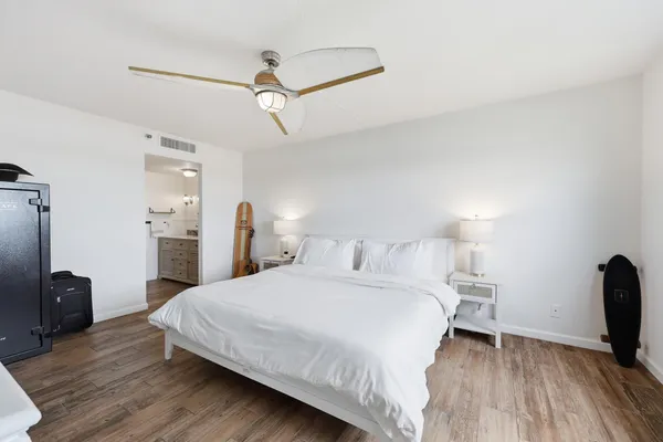 a bedroom with a bed and a desk