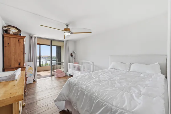 a large white bed in a white room