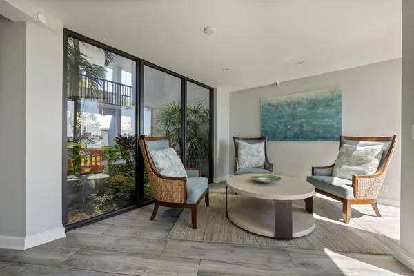 a work room with furniture and a window